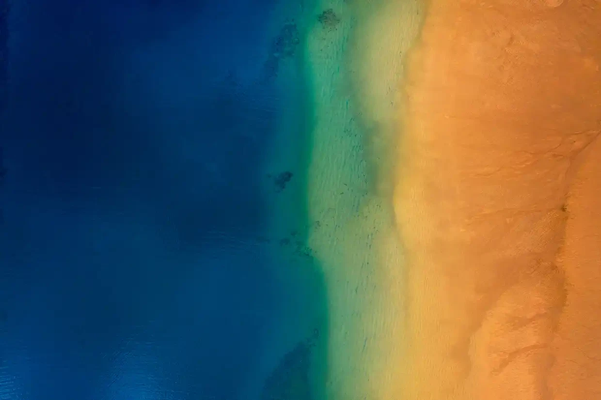 background image of sand and sea